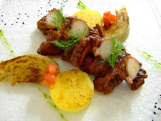 Octopus stewed in tomato sauce on polenta and fennel
