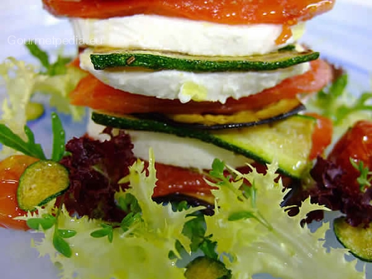 Cold mini Aubergines lasagna with mozzarella and tomatoes on salads