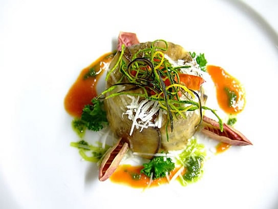 Aubergines pudding on tomato cream with basil