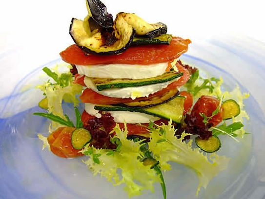 Cold mini Aubergines lasagna with mozzarella and tomatoes on salads